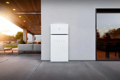 Here are a few examples of image and context pairs: **Image:** A person holding a DSLR camera, taking a photo of a sunset. **Blog Title:** Best cameras for landscape photography **SEO Keywords:** DSLR, camera, landscape photography, sunset **Output Language:** English **Image:** A plate of spaghetti with tomato sauce and basil. **Blog Title:** Quick and easy weeknight dinners **SEO Keywords:** spaghetti, tomato sauce, pasta, dinner **Output Language:** English **Image:** A person hiking in the mountains with a backpack. **Blog Title:** Top hiking trails in the US **SEO Keywords:** hiking, trails, mountains, backpack **Output Language:** English Now, generate the response for the following image: **Image:** A Tesla Powerwall installed on the exterior wall of a modern home. **Blog Title:** Home Energy Storage Solutions **SEO Keywords:** Tesla Powerwall, home energy storage, solar battery, residential battery **Output Language:** English